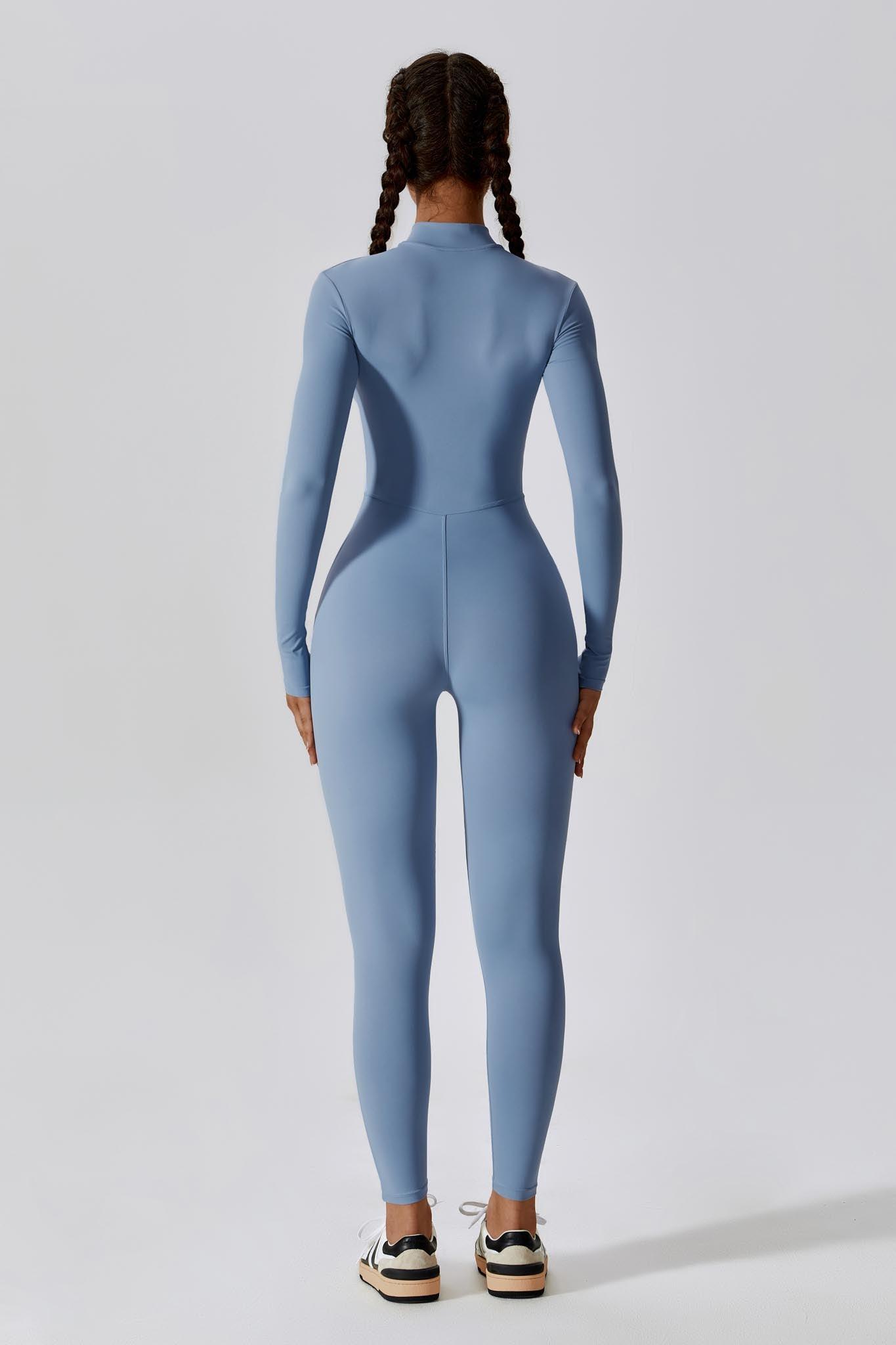 Maison and Aurora Loren jumpsuit in chambray fabric, featuring a relaxed fit with adjustable straps and side pockets.