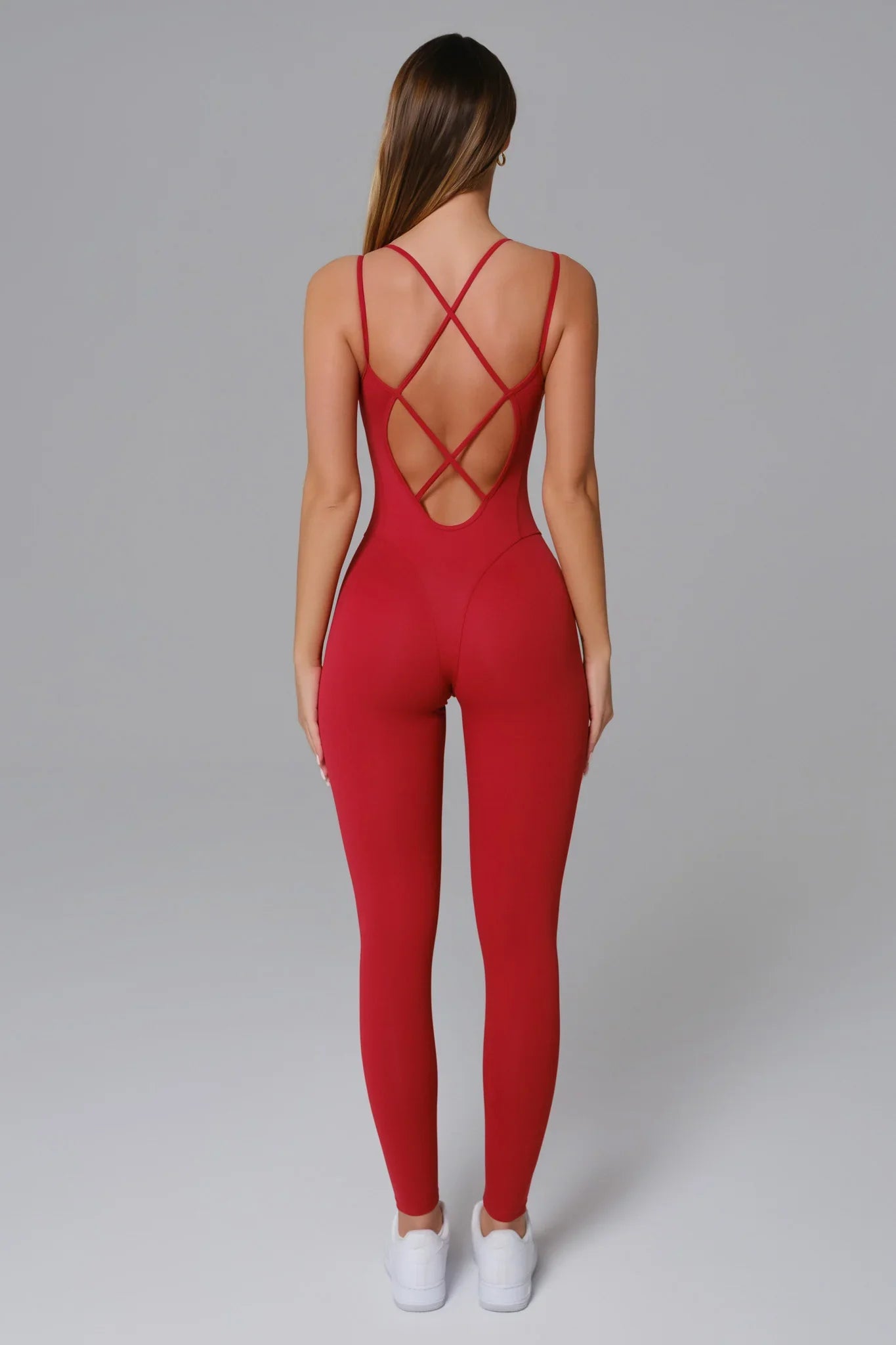 Maison and Aurora Ember Red open back jumpsuit featuring a stylish design and flowy fabric, perfect for elegant occasions.