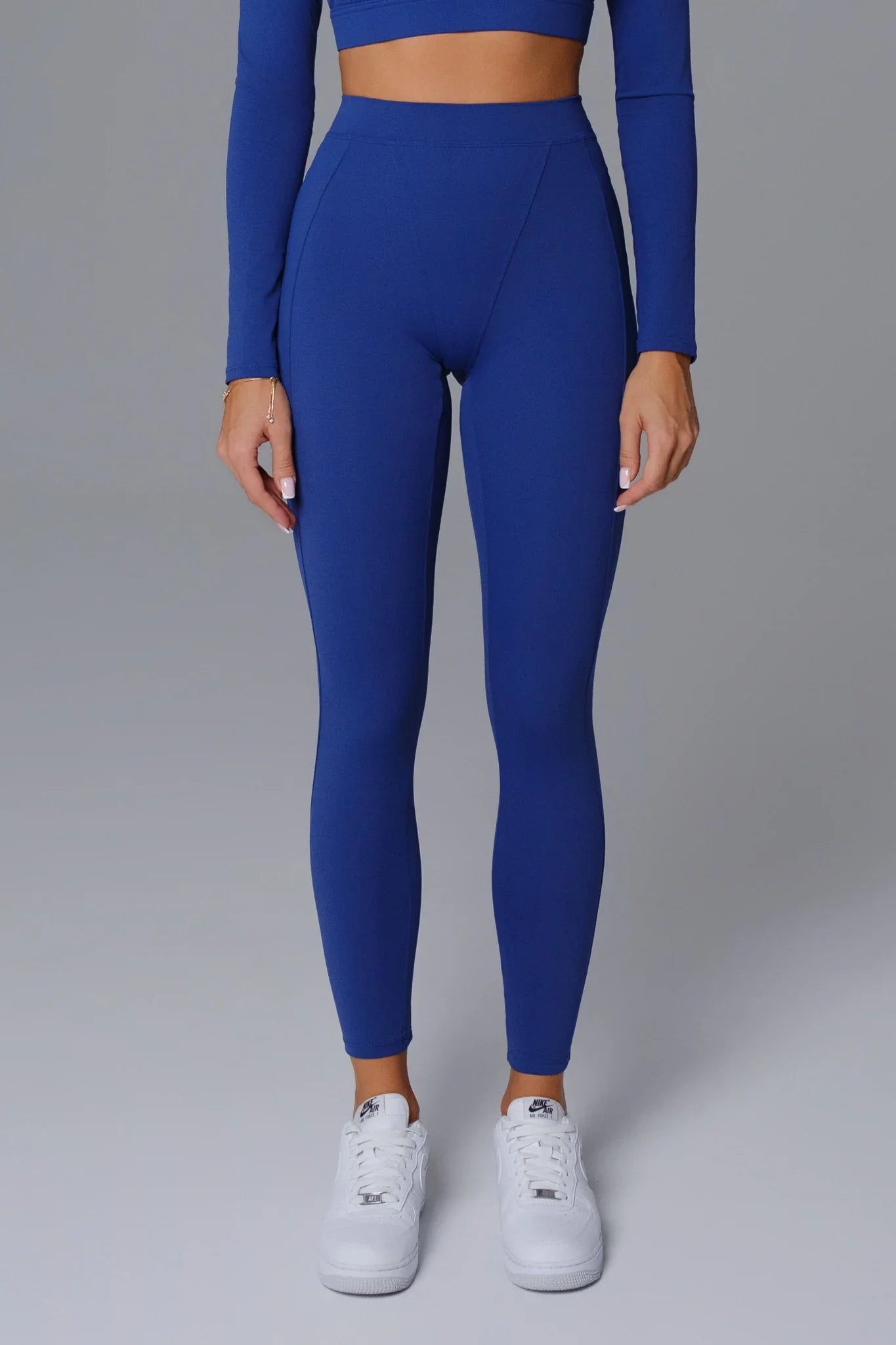 Maison and Aurora sapphire blue high waist sculpting leggings, form-fitting athletic leggings with a smooth, stretchy fabric.