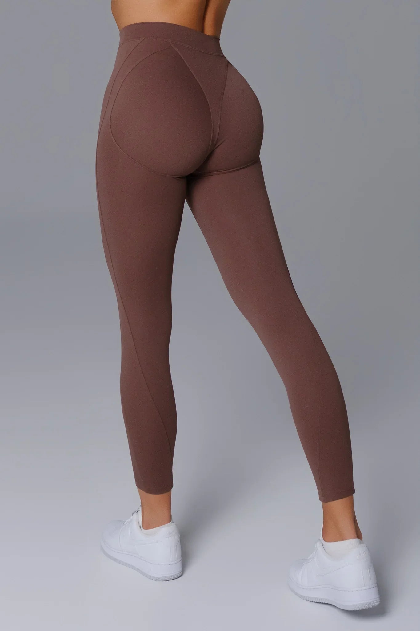 Maison and Aurora essential high waist sculpting leggings in umber, showcasing a close-up of the fitted, stretchy fabric.