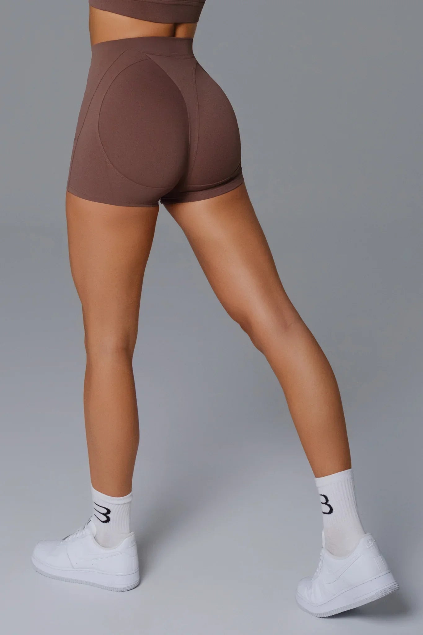 Maison and Aurora high waist seamless scrunch shorts in umber, showcasing the fitted, stretchy fabric and stylish design.