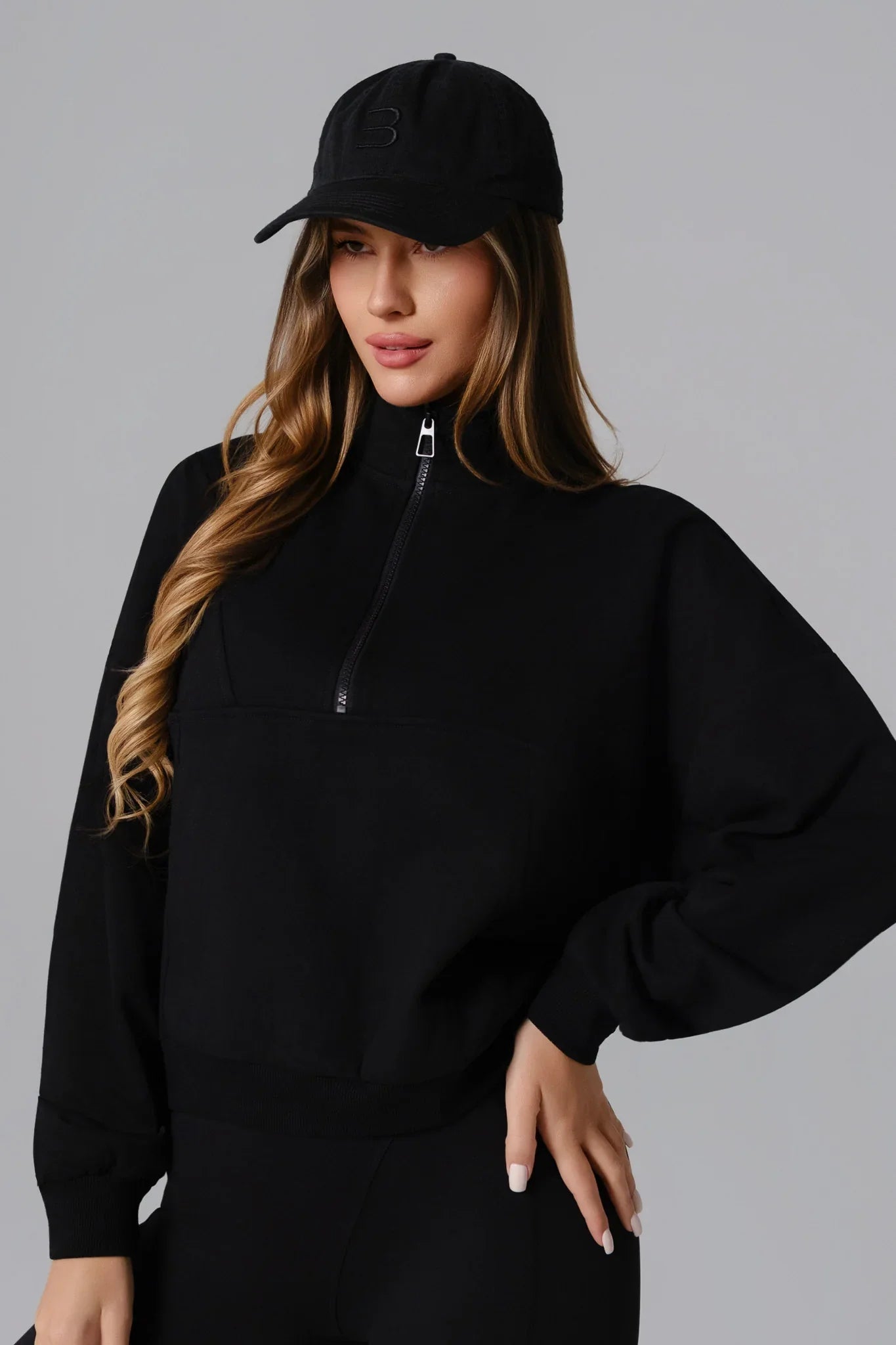 Black Maison and Aurora Essential Half Zip Sweatshirt, a stylish and comfortable tops option with a sleek design and zip collar detail.