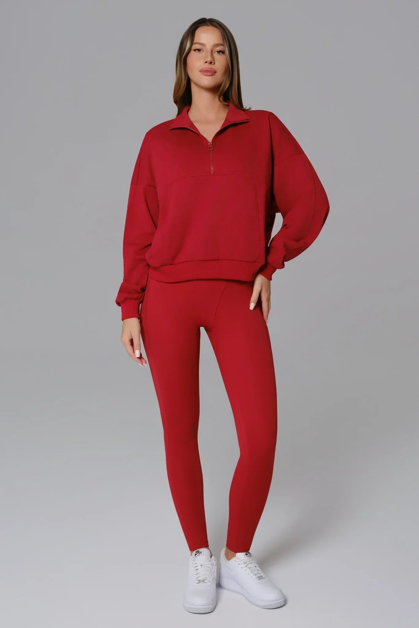 Maison and Aurora Ember Red half zip sweatshirt, a stylish red top with a high collar and comfortable fit.