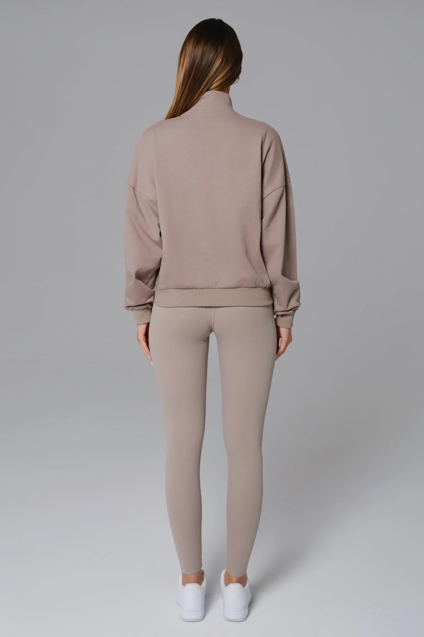 Maison and Aurora Essential Half Zip Sweatshirt in Greige, showcasing a stylish, fitted top with a half zipper and soft fabric texture.