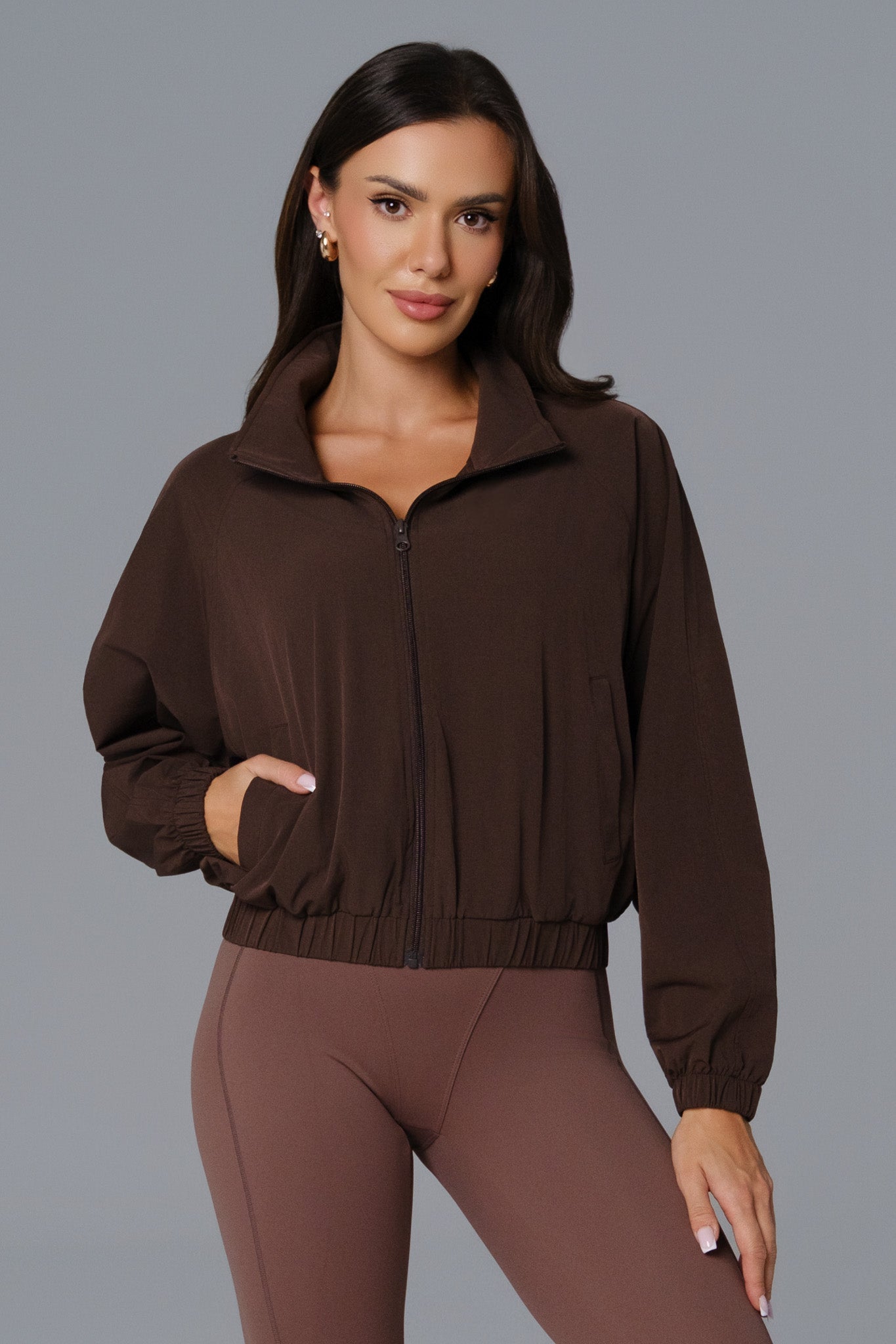 Maison and Aurora Ava cropped windbreaker jacket in russet brown, shown as a stylish, lightweight tops piece.