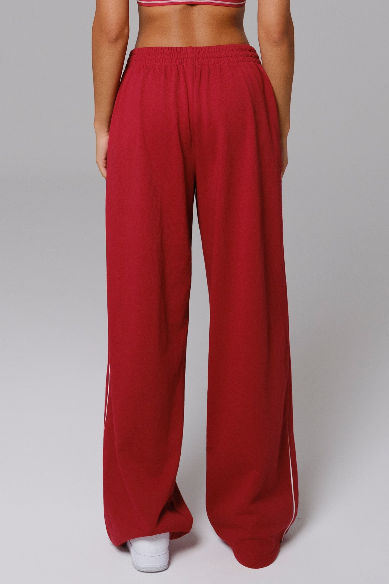 Maison and Aurora Shelly Sweatpants in cherry red, soft fabric with a relaxed fit and elastic waistband, casual loungewear style.