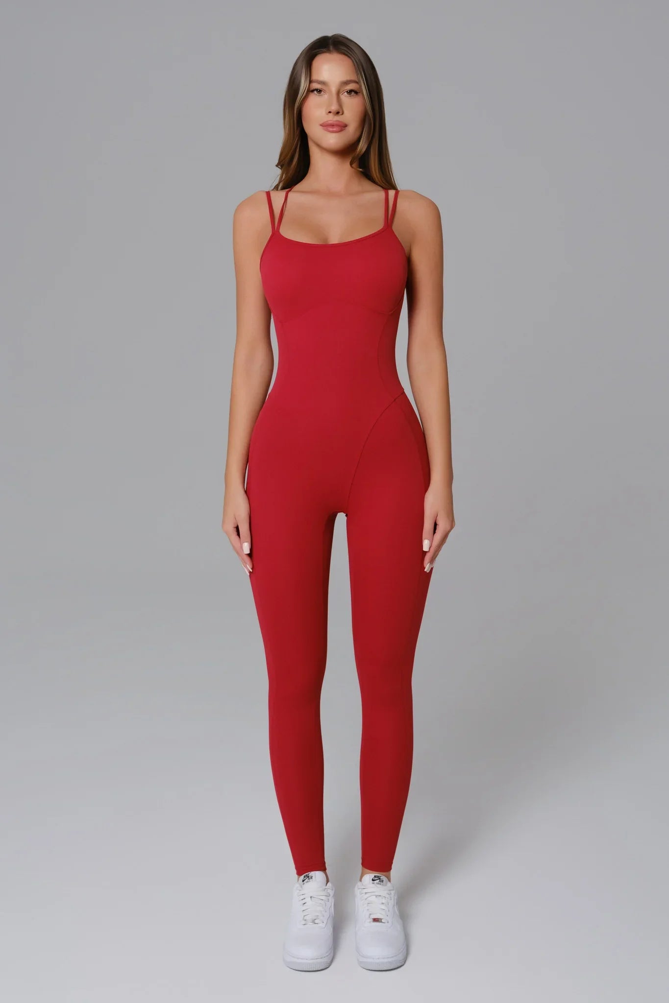Maison and Aurora Ember Red Essential Open Back Jumpsuit displayed on a model, featuring a stylish open back design and vibrant red color.