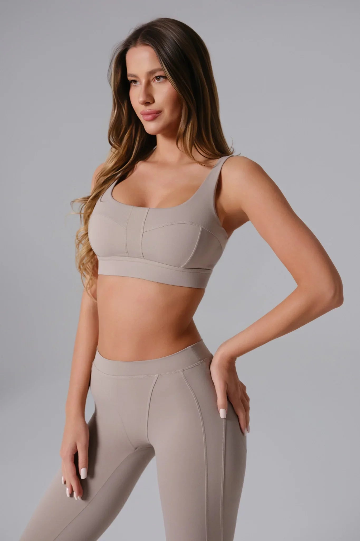 Maison and Aurora high waist sculpting leggings in greige, showcasing a close-up of the fitted, stretchy fabric and sleek design.