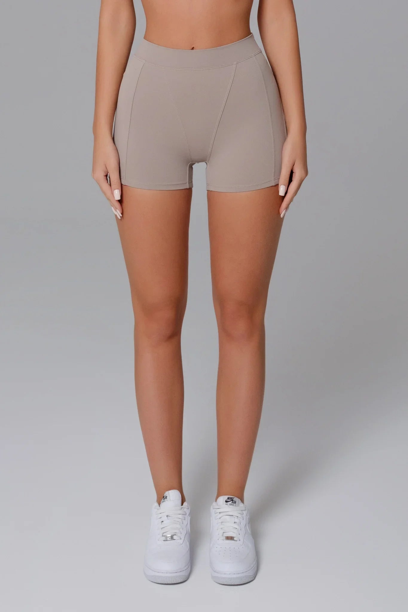 Maison and Aurora Essential High Waist Seamless Scrunch Shorts in Greige, showcasing the smooth, stretchy fabric and high-waist design.