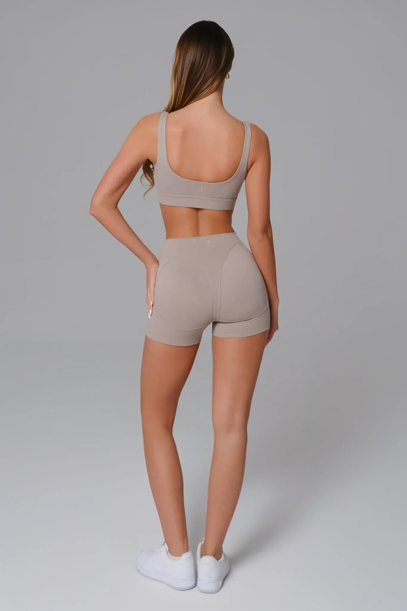 Maison and Aurora high waist seamless scrunch shorts in greige, showcasing the soft fabric and flattering fit.