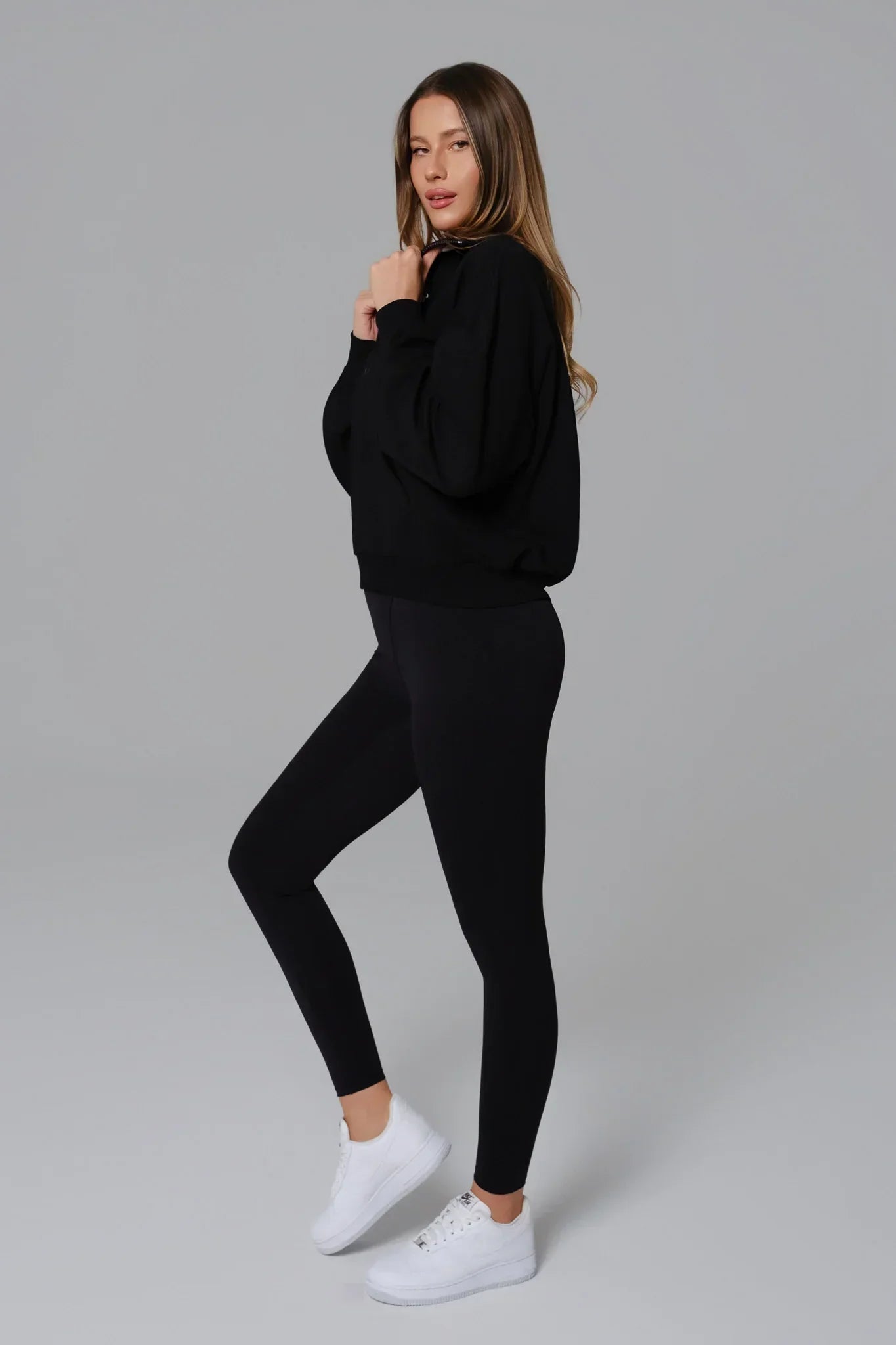 Black Maison and Aurora Essential Half Zip Sweatshirt, a stylish casual top with a half zip closure and comfortable fit.