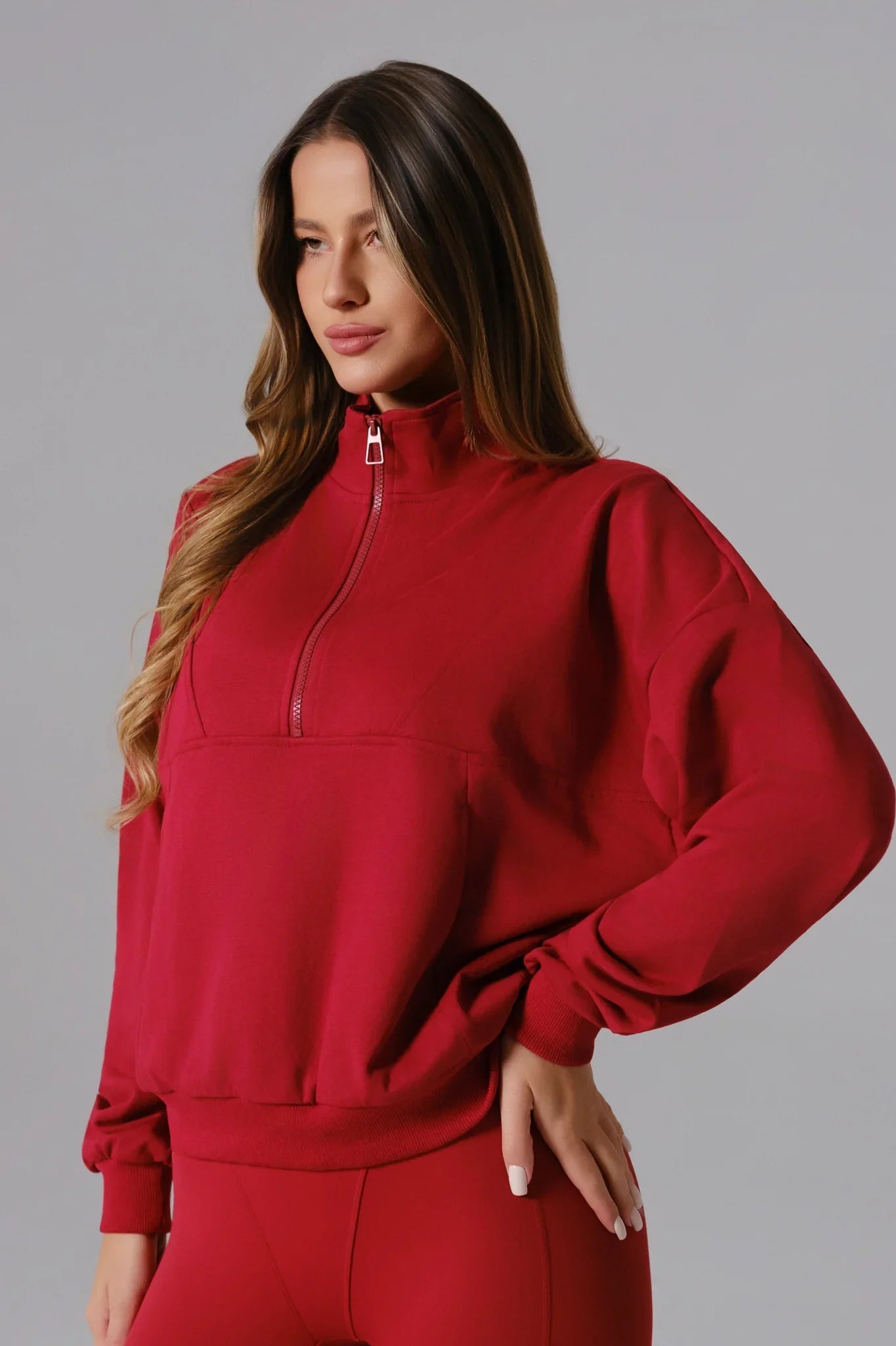 Maison and Aurora Essential Half Zip Sweatshirt in Ember Red, close-up of the cozy red top with half-zip collar and soft fabric.