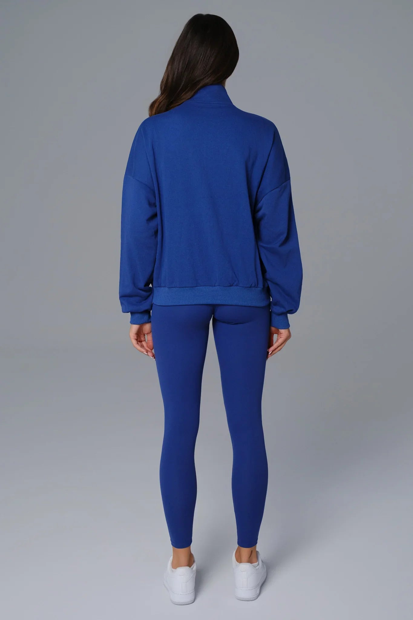 Maison and Aurora sapphire blue half zip sweatshirt, casual top, showcasing the front with a zipper and soft fabric texture.