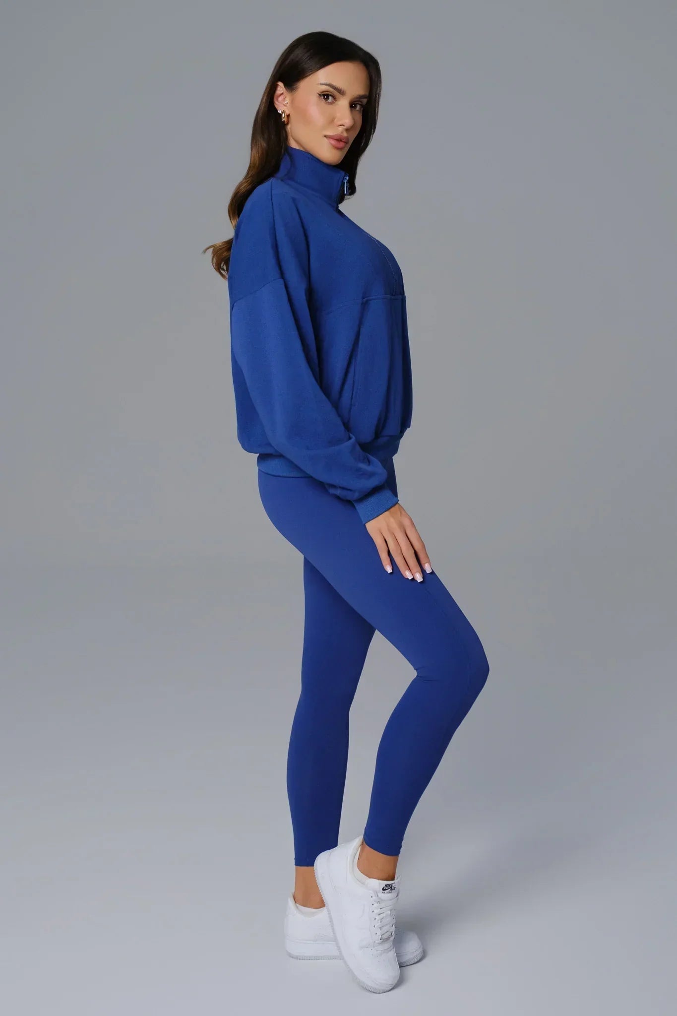 Sapphire blue Maison and Aurora Essential Half Zip Sweatshirt, close-up of the soft fabric and half-zip neckline.