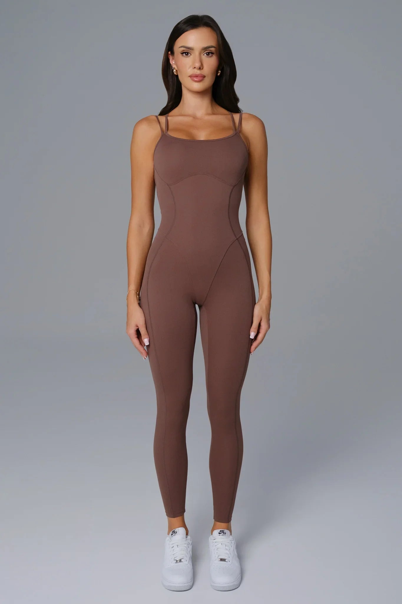 Maison and Aurora umber open back jumpsuit with wide legs and plunging back design, stylish and comfortable for elegant occasions.
