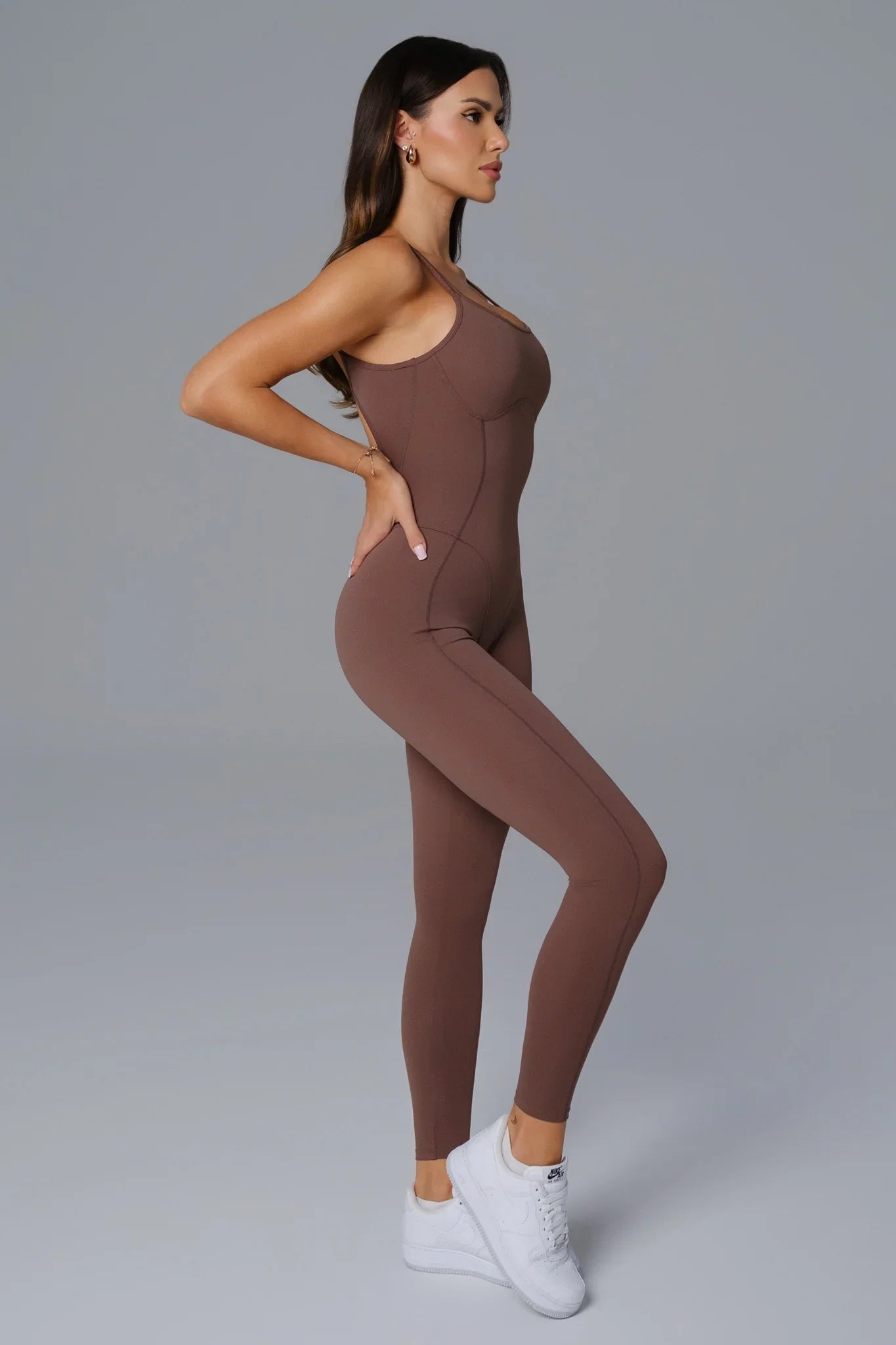 Maison and Aurora umber open-back jumpsuit with wide legs and waist tie, stylish and comfortable for casual or semi-formal wear.